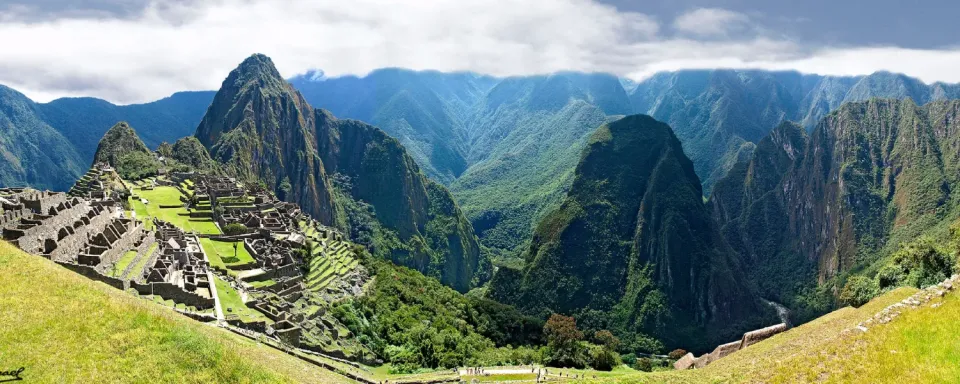 Experience the wonder of Machu Picchu. Incredible panoramic view of the majestic ruins of Machu Picchu.